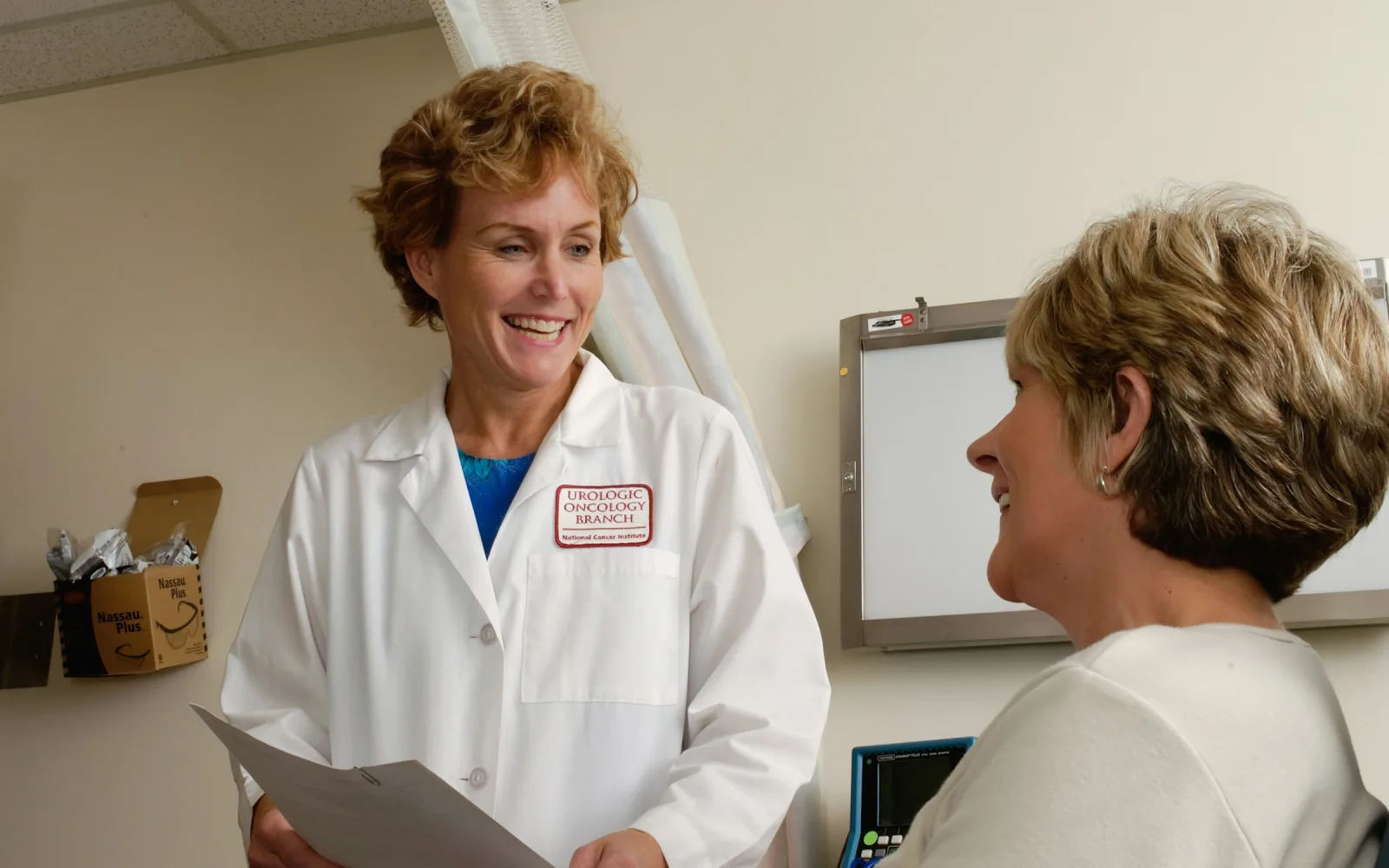 Doctor explaining a report to a woman patient